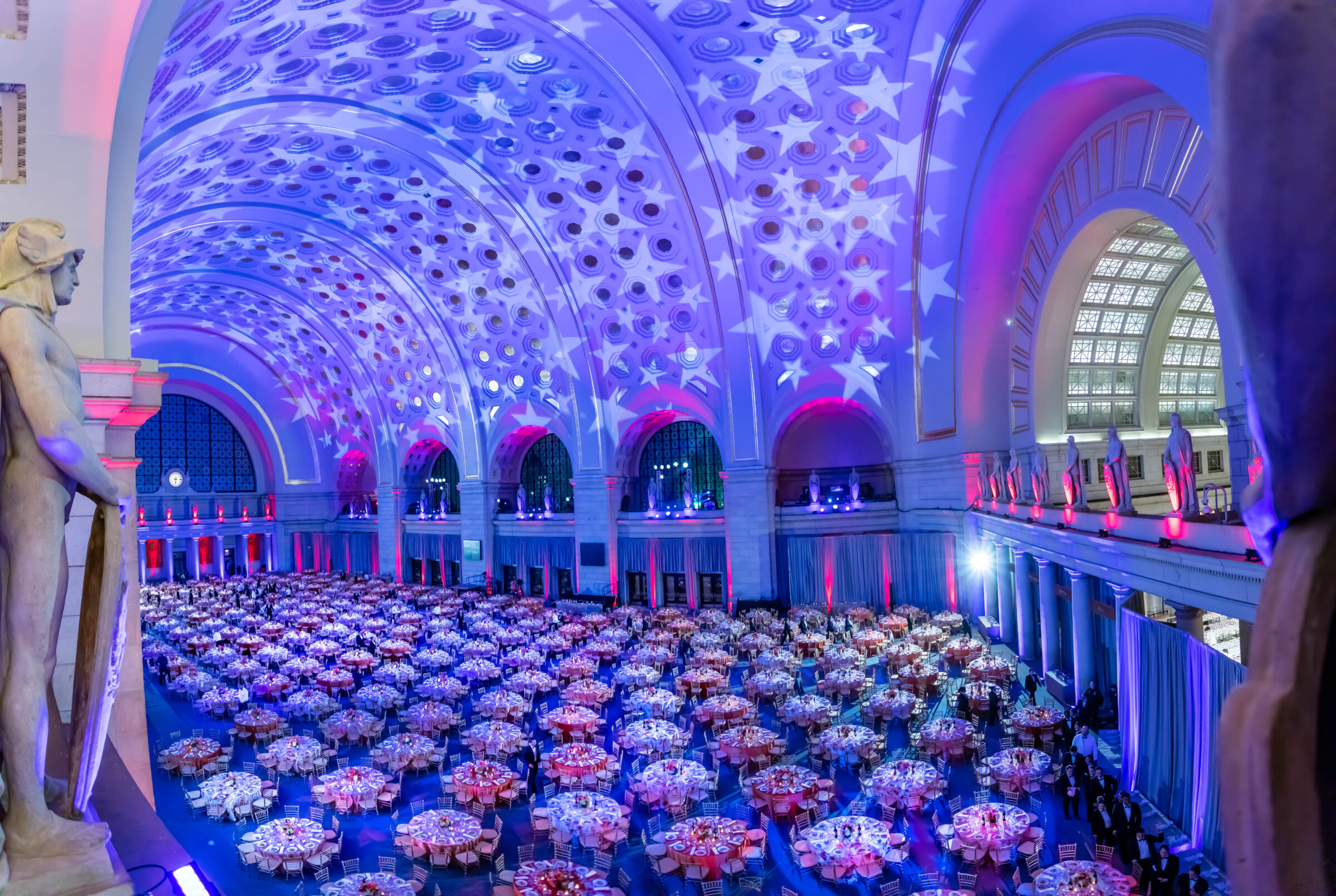 A panoramic view of Union Station set up with circular tables for an event.